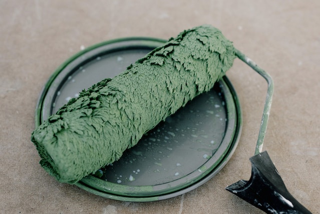  a roller with green paint on it